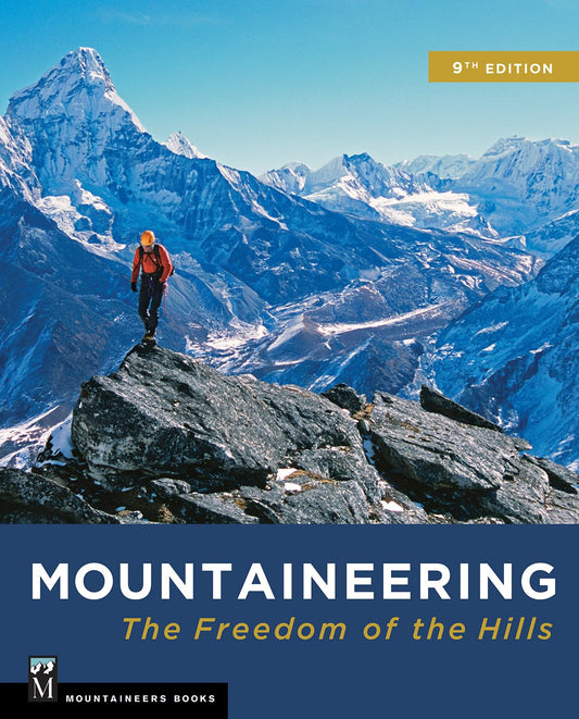 Book cover of 'Mountaineering: The Freedom of the Hills' with a climber on a mountain peak.